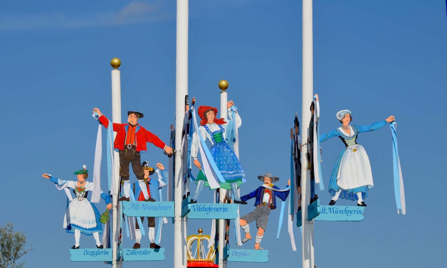 Decorations depicting men and women in traditional German costumes, at Oktoberfest celebrations in Munich, Germany.